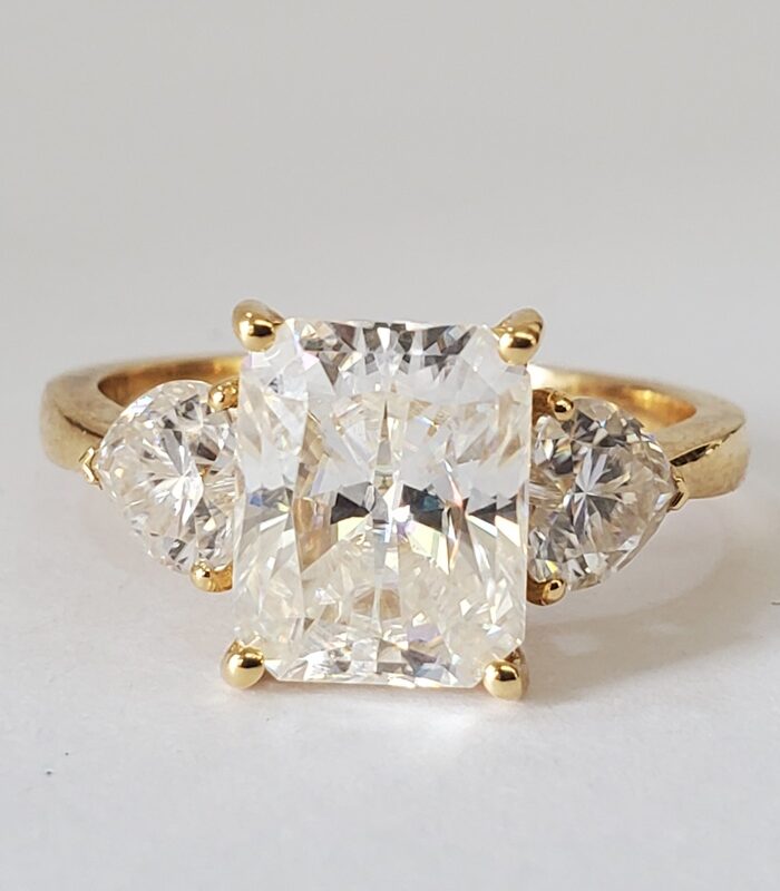 EMERALD TRILOGY VVS1 MOISSANITE 18KT YELLOW GOLD ENGAGEMENT RING